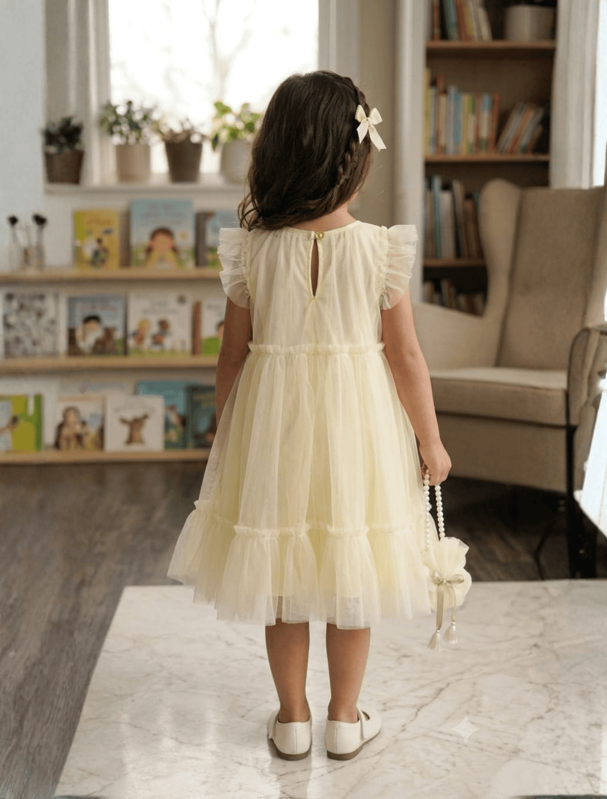 whisperingpoppers summer frocks A-Line yellow soft net Tulle Ruffle Frock with matching Bag and pearl strap  — back side view- Girls age 4 to 9 Years 