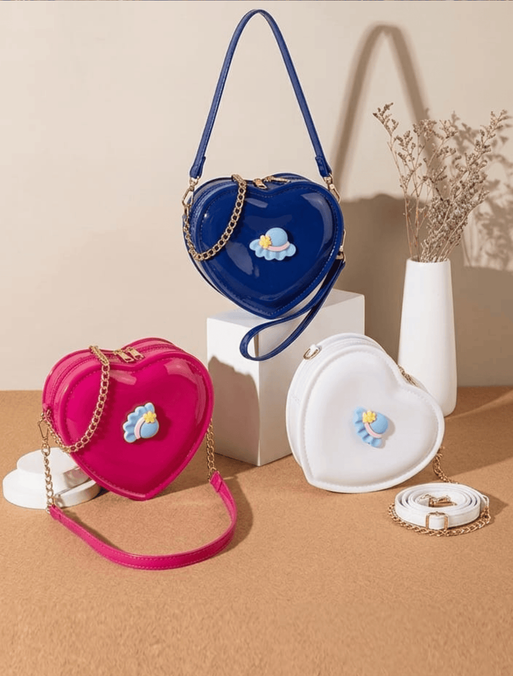 whisperingpoppers bags Mini Heart- Shape Shoulder Pearl Bag girl age 3-14y.fine leather quality.imported bag .pearl strap  for carrying on hand .long golden chain strap for carrying on shoulder.shocking pink colour,blue colour and white colour heart shape bag.beautiful vibrant colour.eaye catching modest desgin