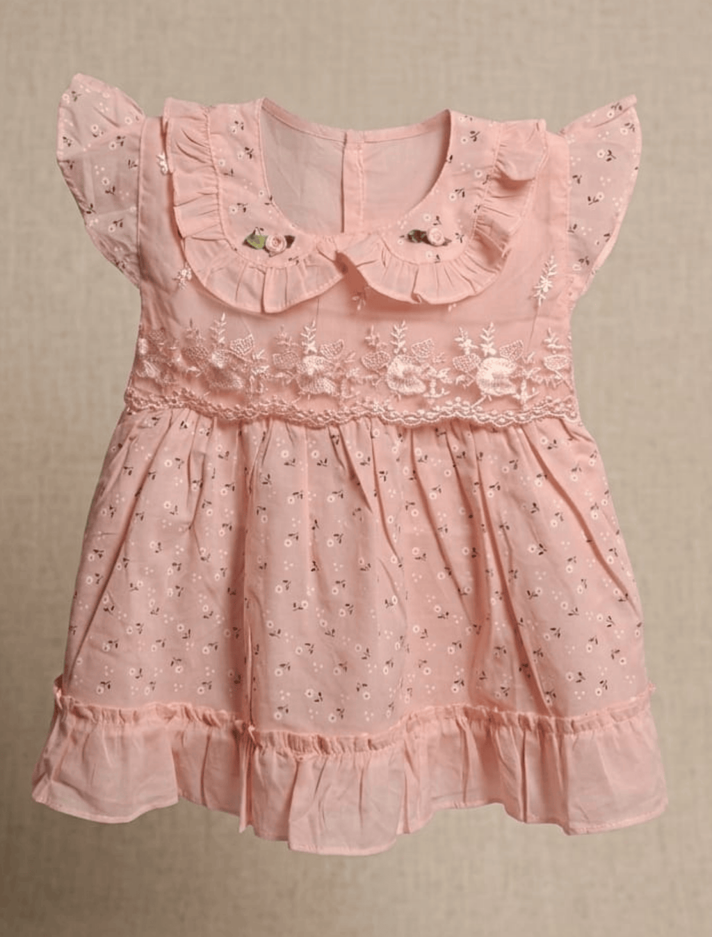 whisperingpoppers summer frocks Pastel Pink Hues Lawn Frock-girl age 9 month-1.5 yearr.front view of the frock . perfect to wear in pakistan in hot long summer day .modest fashion.comfortable breathable  fabric.peterpan coller neckline .pastelpink base with print on it.embroidery soft net detils on bodice .frill on the end give it  beautiful look