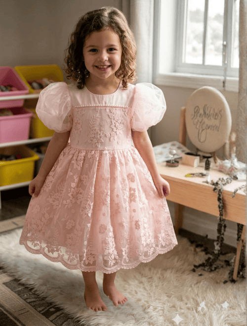 whisperingpoppers summer frocks ✨ Princess Pink Embroidered Net fancy Frock  for  Girls  age 3-8y ✨ girl is showing front side of embroidery detalils of dress. soft net breathable fabric.soft cotton lawn inner perfect wear in summer hot days .fancy dress .puff sleeves.best foe weddings, anniversaries,events, parties, birthday ang get to gather.imported stuff  .imported frock