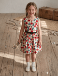 whisperingpoppers summer frocks Floral Cotton Frock with Belt — Vintage Style Girls 1y to 6 Years .red and teal green floral pattren on cotton vintage style frock with black leather belt girl wearing knee length vintage cotton frock .showing front view of the frock .perfect in pakistan summer season.sleevlee frock