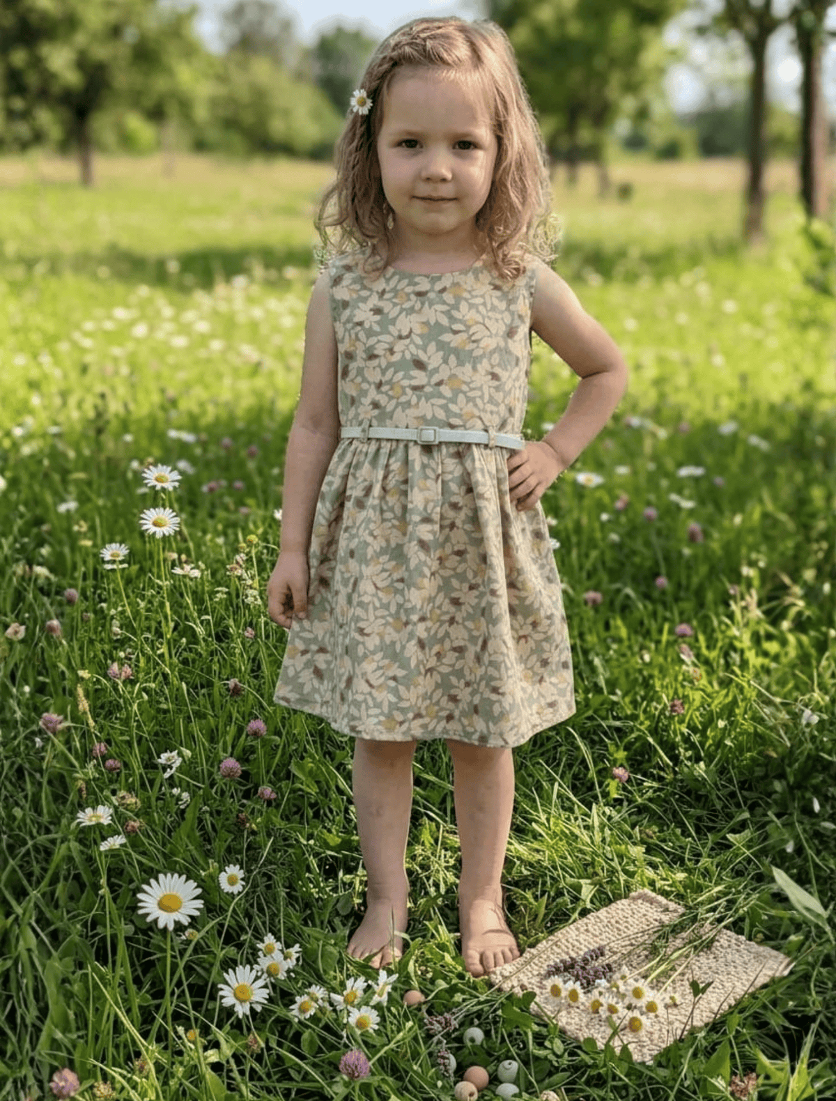 whisperingpoppers summer frocks Floral Cotton Frock with Belt — Vintage Style Girls 1y to 6 Years  sage green colour floral printed desgin.girl is wearing knee length  with silver belt .front view of the frock.perfect for hot summer days in pakistan.wear it on all day long  gatherings.event lunch and dinner.breathable comfortable fabric.imported