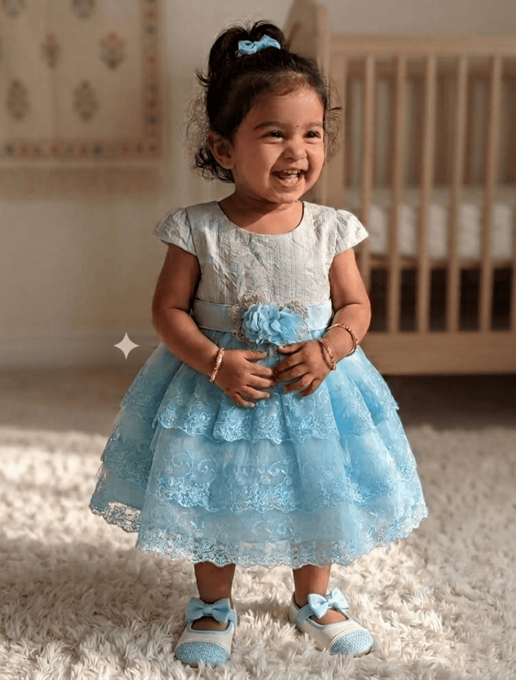 whisperingpoppers summer frocks Sky Blue & White Tiered Lace party wear Frock for Baby Girls 6month-2year..fancy,net 3 tier layer design frock .flower motif on belt .girl showing front side of baby doll frock.perfect for wedings,anniversaries,birthdays,and parties.pakistan hot fashion 