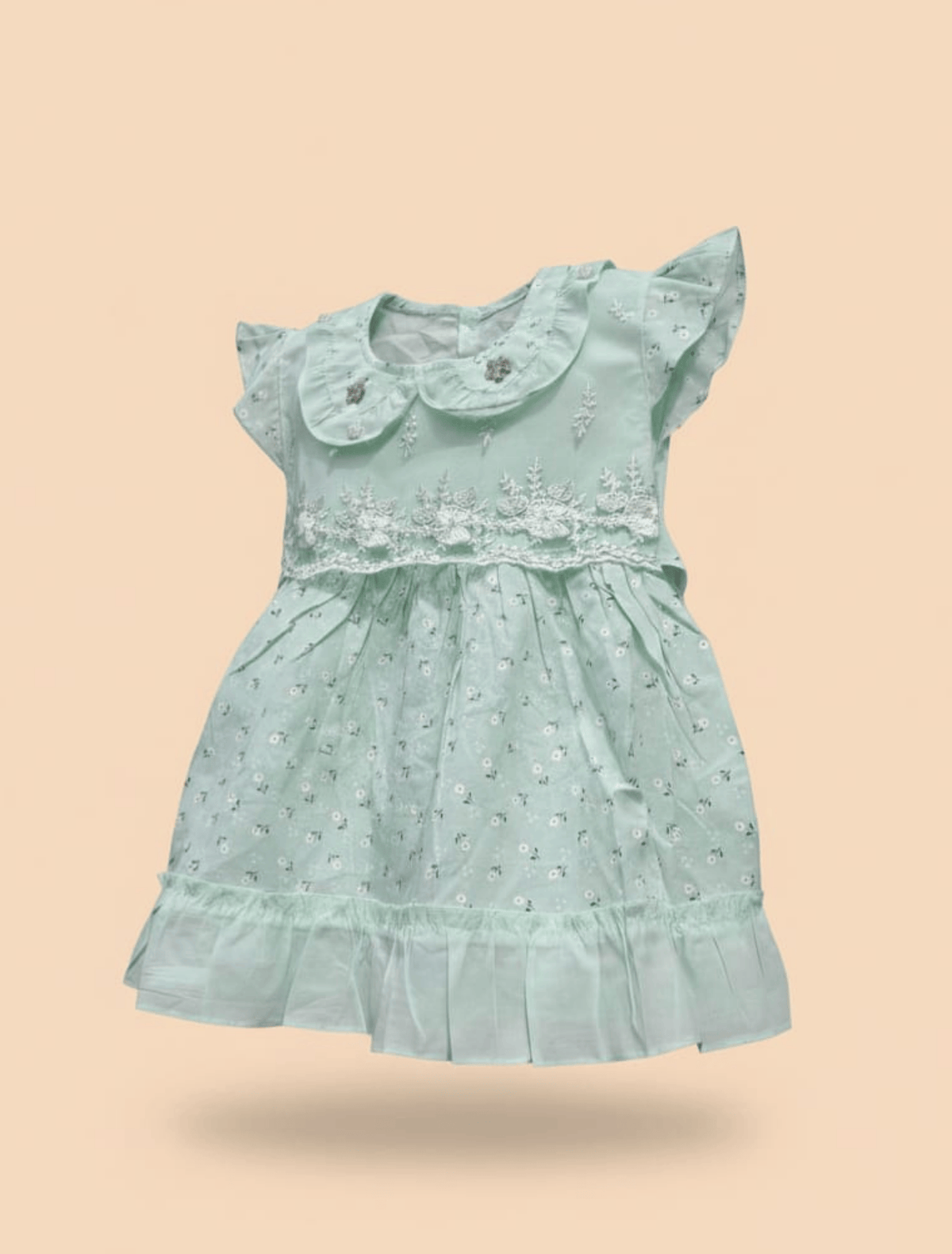 whisperingpoppers summer frocks pistachio hues lawn frock-Baby girl age 9 month-1.5 year .flat lay detail of dress. breathable lawn fabric frock .peterpan coller and embriodered net bodice and lawn printed desgine. frill desgine on end of the frock.beautiful printed fabric. cool in hot summer days of pakistan.belt on back for adjustment and button on back for easy wear