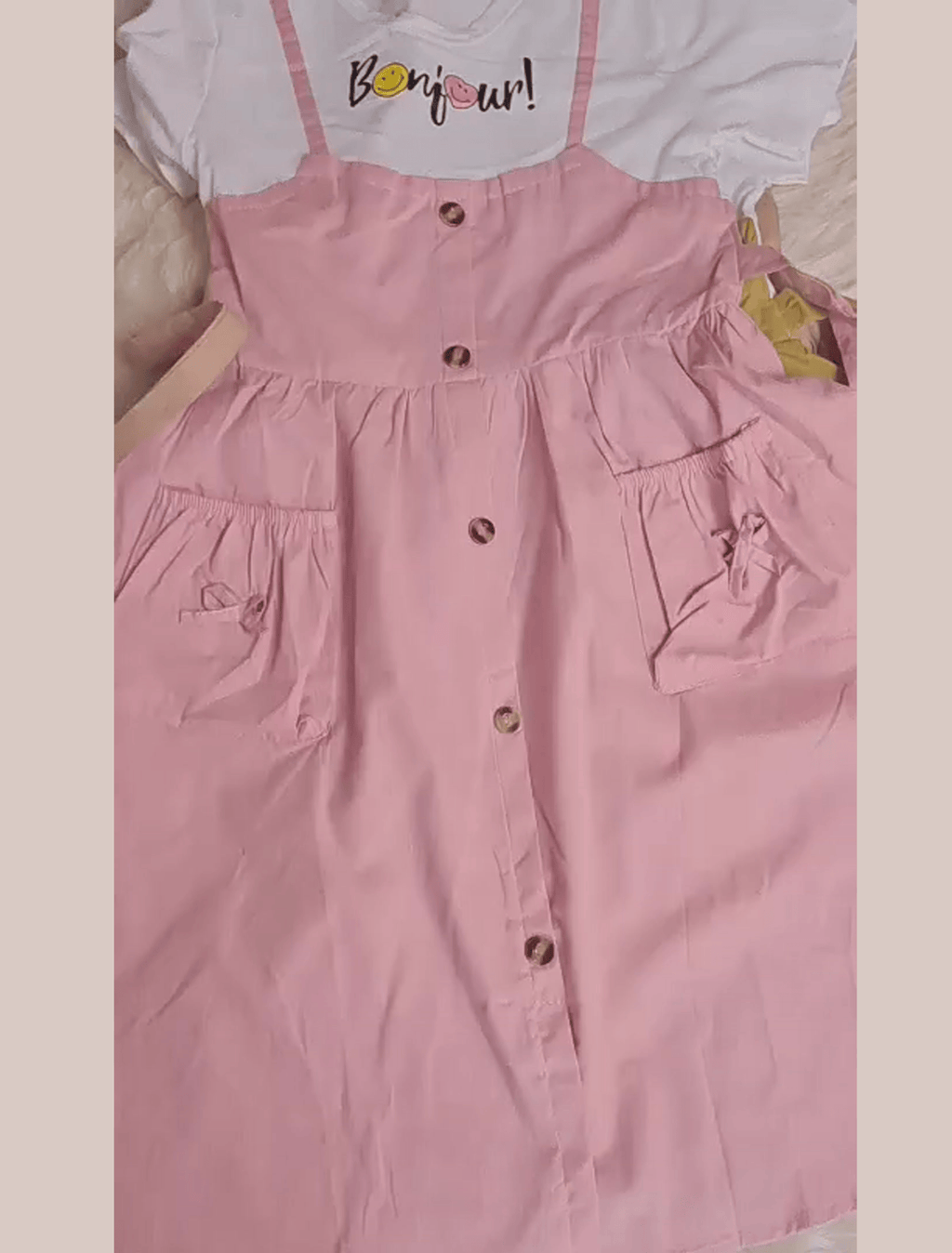 whisperingpoppers summer frocks  teapink colour T-shirt+pinrfore syle frock - girl age 1-6y front lay with closeup view.imported frock with button and 2 front pocket detils.modest style to wear in pakistan summer season .parties.functions.birthdays,tours.