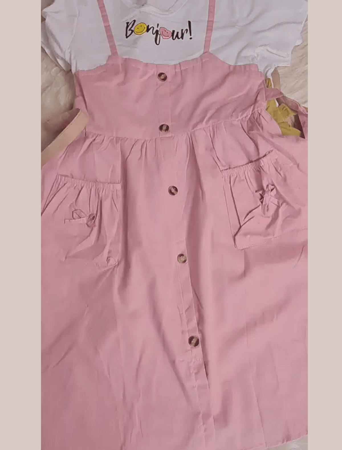 whisperingpoppers summer frocks  teapink colour T-shirt+pinrfore syle frock - girl age 1-6y front lay with closeup view.imported frock with button and 2 front pocket detils.modest style to wear in pakistan summer season .parties.functions.birthdays,tours.
